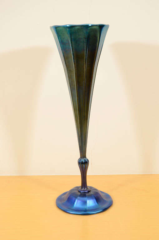 Large blue iridescent Tiffany Studios, favrile glass vase, with ribbed decoration, knobbed stem and a circular foot, in cobalt blue glass, blue iridized surface, signed 1066-6799 M L. C. Tiffany Inc. Favrile, measuring 14