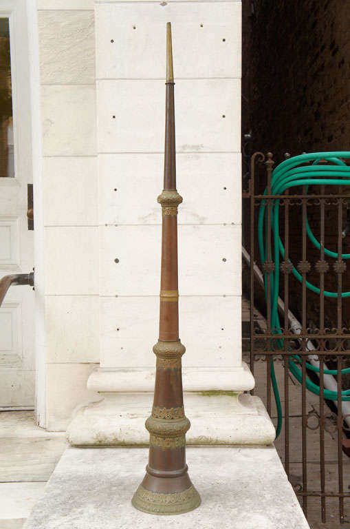 A collapsible Firemans bugle horn made of copper and brass. Missing the mouth piece