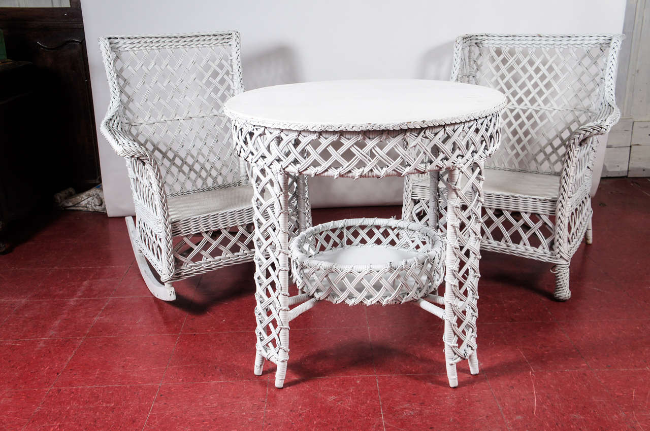 Set of 3 stick wicker, split reed rattan rocking chair, table and arm chair.  The set is well-constructed with both white basket and lattice weave. Cross stretchers near bottom of each piece adds to sturdiness.

Rocking chair, 30