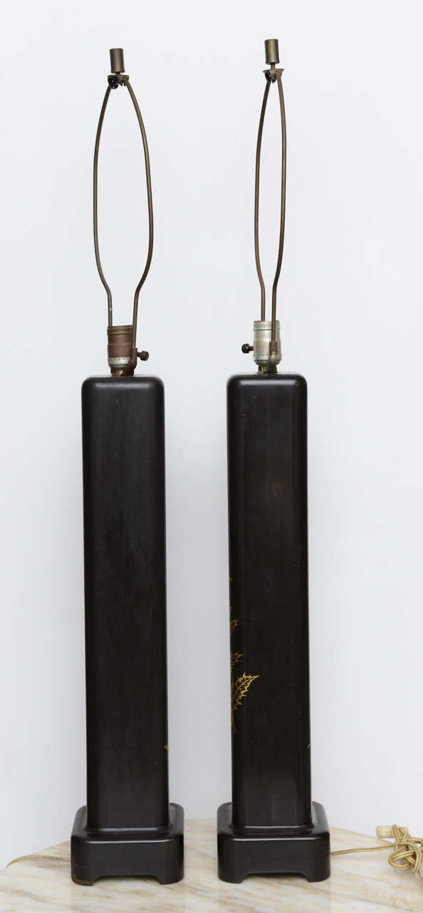Pair of Vintage black lacquer lamps with gilt bird motif.