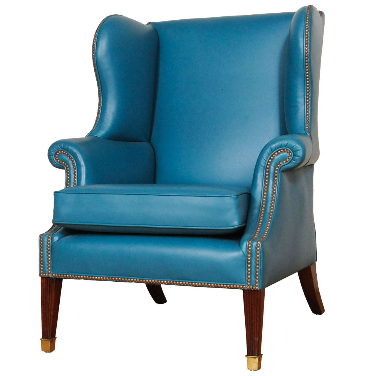 A lovely brightblue leather upholstered English wingchair, early 19th century For Sale