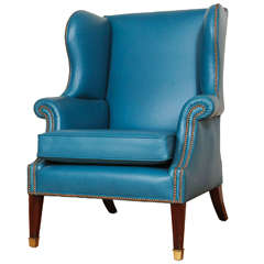 Antique A lovely brightblue leather upholstered English wingchair, early 19th century