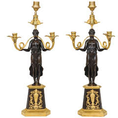 A large pair of ormolu and bronze Nikè Empire candelabra.