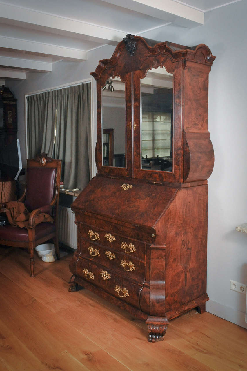 A fantastic Dutch burr walnut  bureau bookcase with mirror doors, circa 1740.