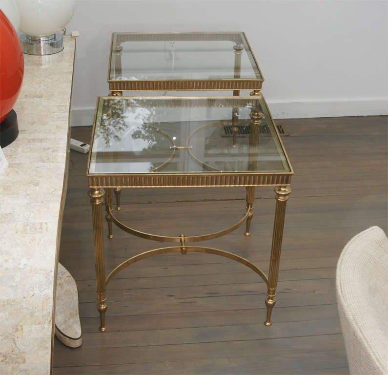Pair of brass and glass side tables.