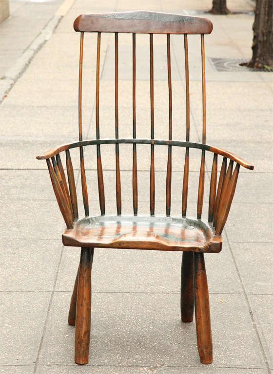 Impressively scaled English painted yewwood comb back windsor armchair, ex Robert Young,  the comb supported by 8 shaved spindles over bent wood arm supported by bulging spindles over heavily shaped saddle seat over four hewn legs, retaining much