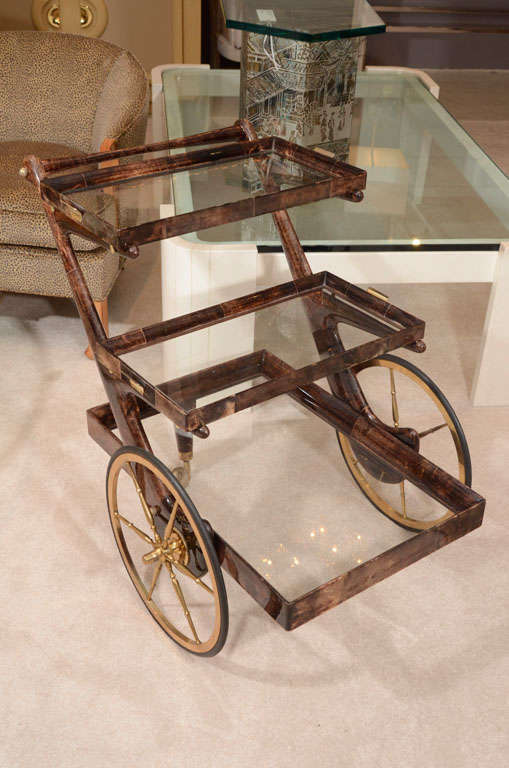 Richly nuanced brown lacquered parchment liquor cart designed by Aldo Tura with 2 removable trays.

THIS ITEM IS NOW LOCATED IN OUR MANHATTAN SHOWROOM: 
200 LEXINGTON AVE - 10TH FLOOR, NYC.