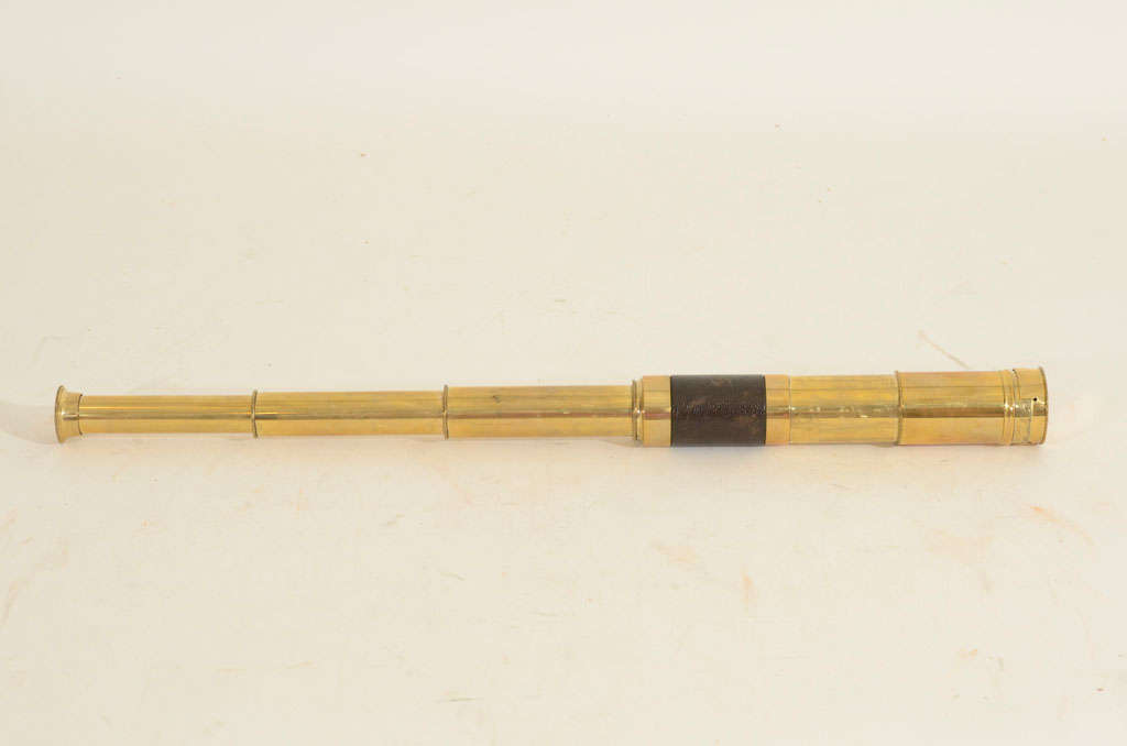 Brass and Leather Folding Telescope with Removable Cap.  England, Late 19th / Early 20th Century

18.5 inches long x 1.5 inches diameter (6 inches long, collapsed)