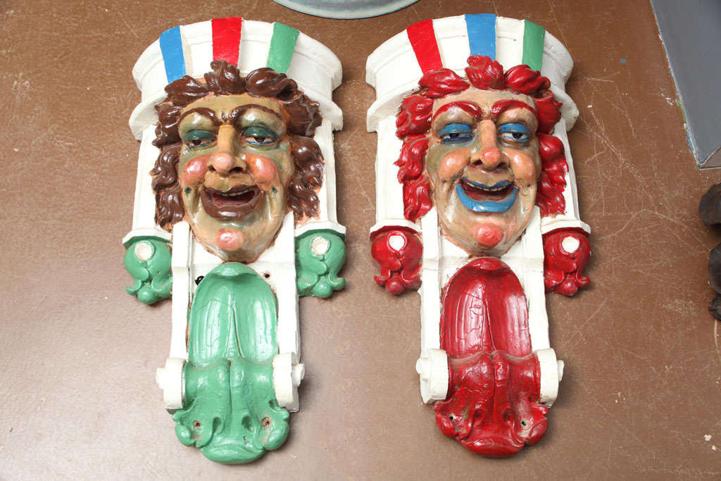 Fabulous pair of plaster and horsehair painted carnival faces from an English traveling circus.