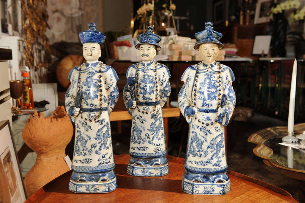 Set of three (3) Blue and White porcelain Chinese Figures with marking on underside.