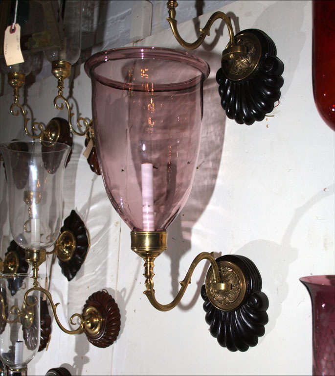 pair of dramatic looking pale amethyst glass globes on sconces