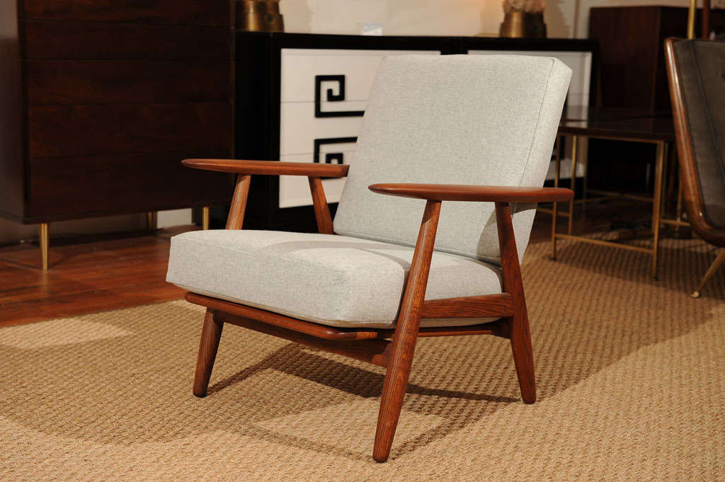 Simple and masculine armchair designed by Hans Wegner for Getama, Completely restored and upholstered Maharam felt. Net $2400.00