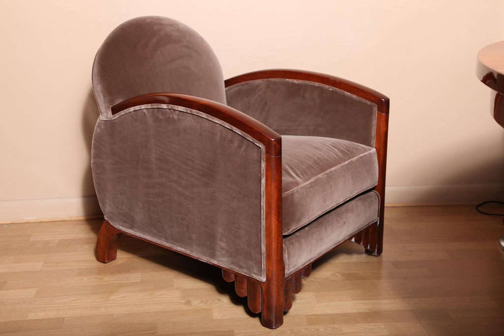 Elegant Pair of Art Deco armchairs with carved mahogany front legs. Taupe silk velvet upholstery.