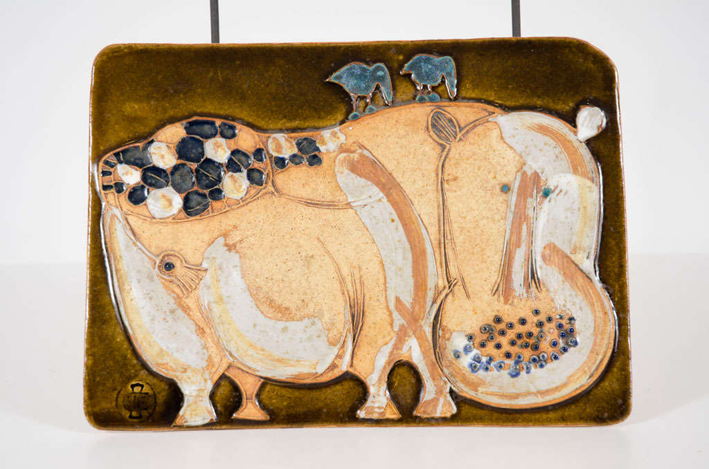 A charming ceramic plaque of a colorful hippo with two birds riding its back. Maker's mark to the lower left corner. By Hall Fromhold. U.S.A., circa 1960.