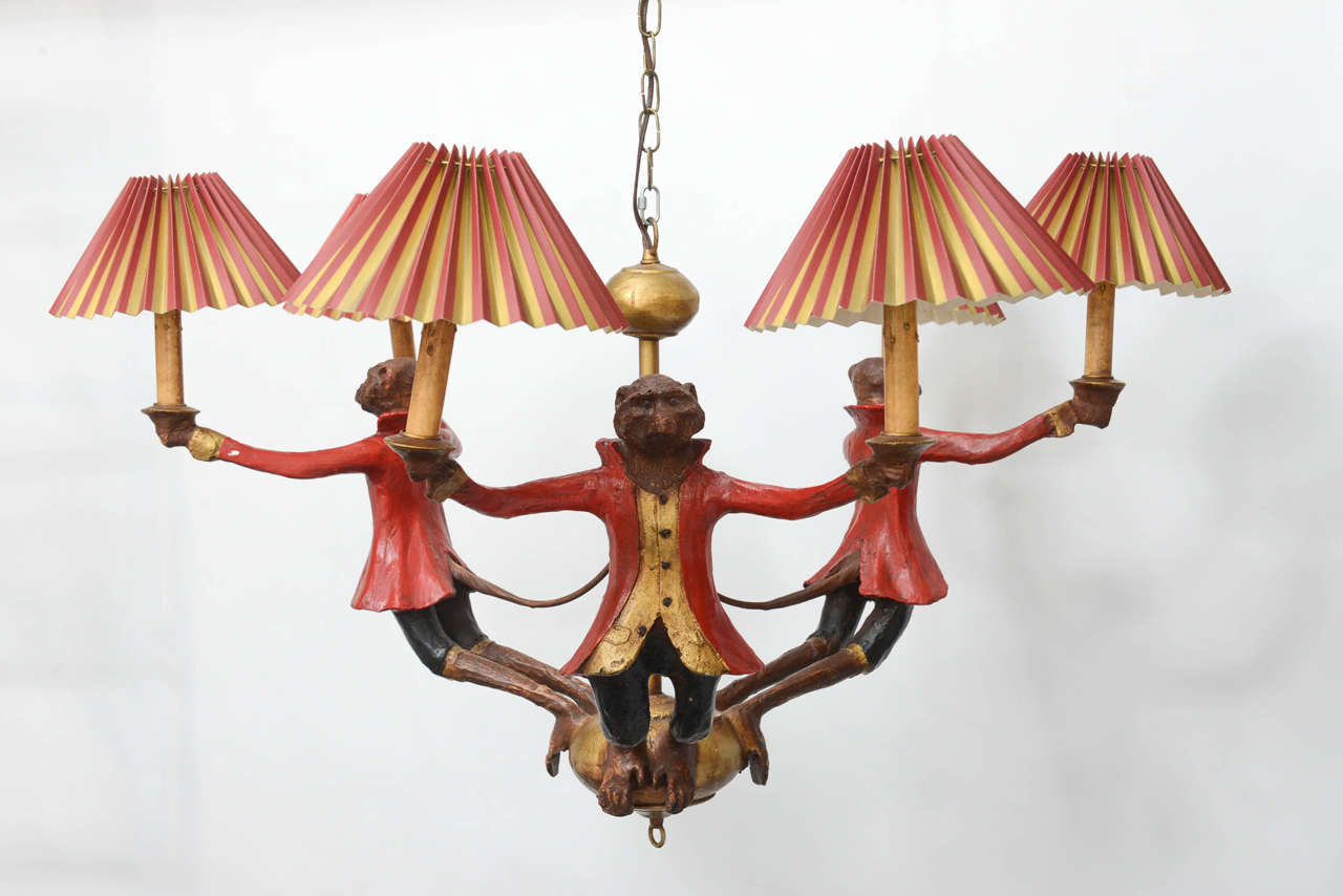 This is an original, handcrafted Bill Huebbe's chandelier hand-painted with glass eyes. This unusual and whimsical fixture will add a touch of humor to any space in your house. Signed by the sculptor Huebbe and dated 1996, on the center where the