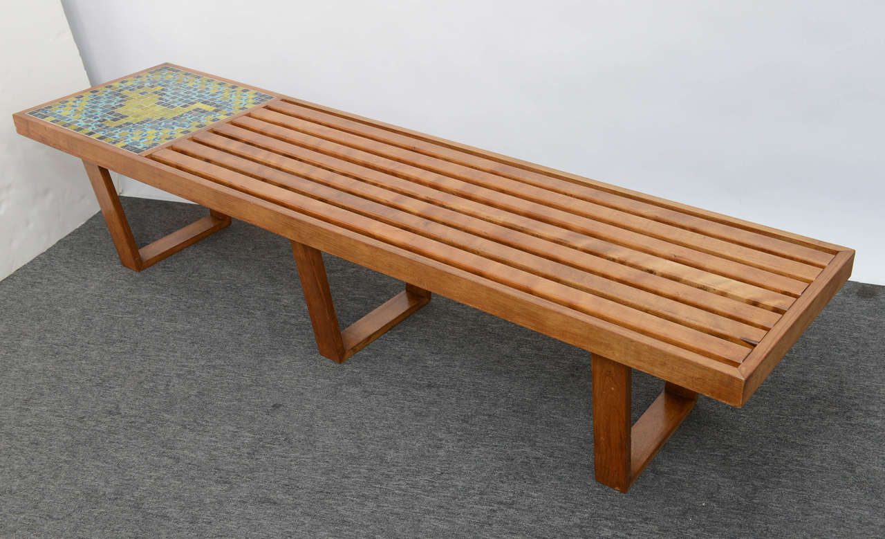 This unique Mid-Century walnut slat table and handmade mosaic inlay in aqua, gold and blue tones in the style of George Nelson,  will bring some Miami touch to your house.The table is in good condition. Beautiful patina and minor age related