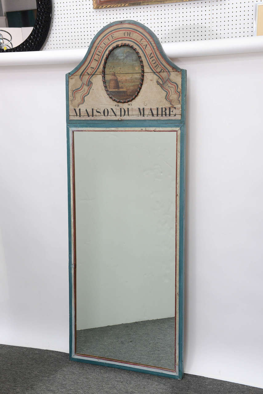 Beautiful and classic, this Trumeau mirror brings the elegance of classic French homes to yours. Translation of French on the mirror says: 