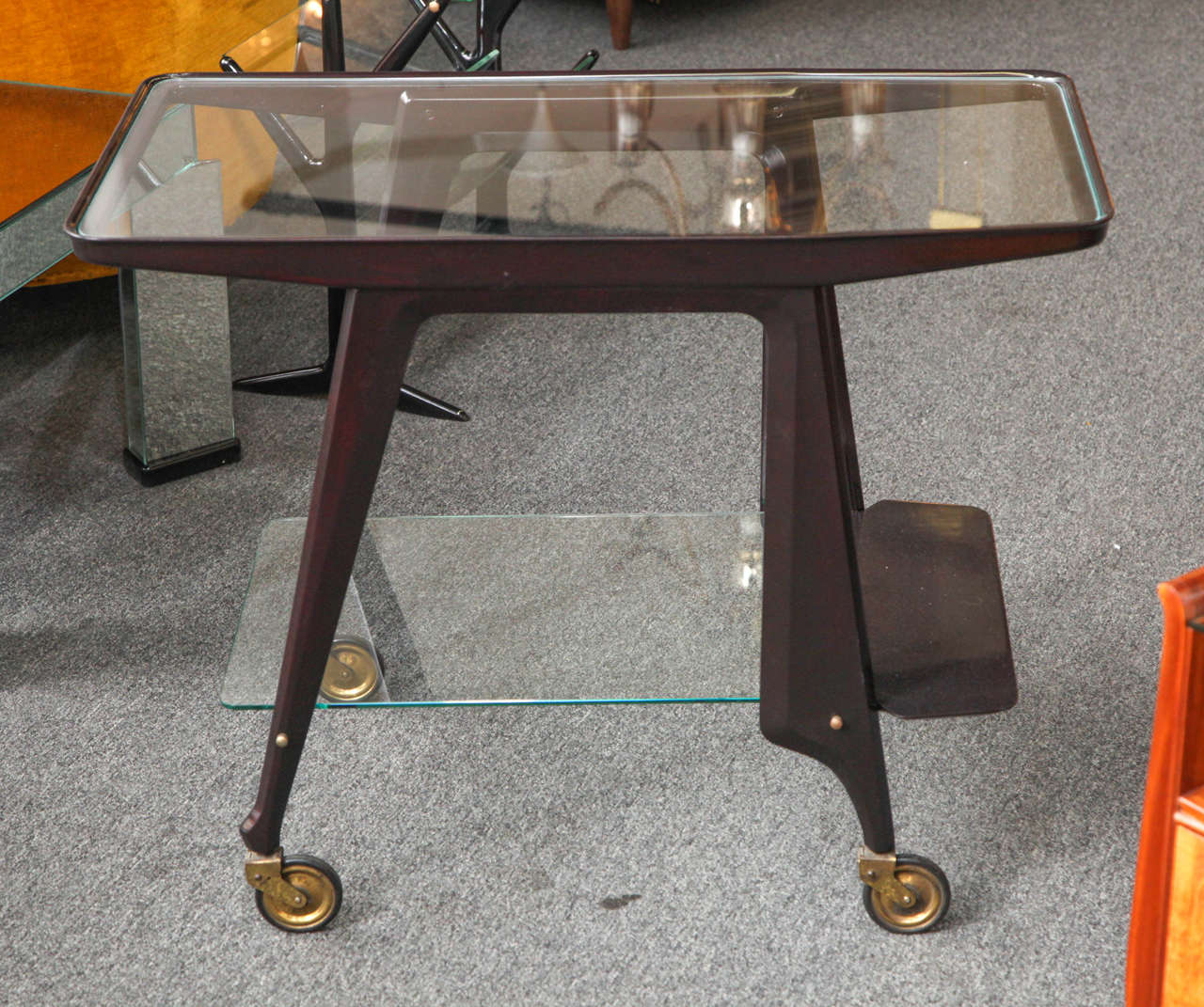 Stylish bar or serving cart designed by Cesare Lacca made in Milan 1950. Wonderful form, unusual model, great quality.
 