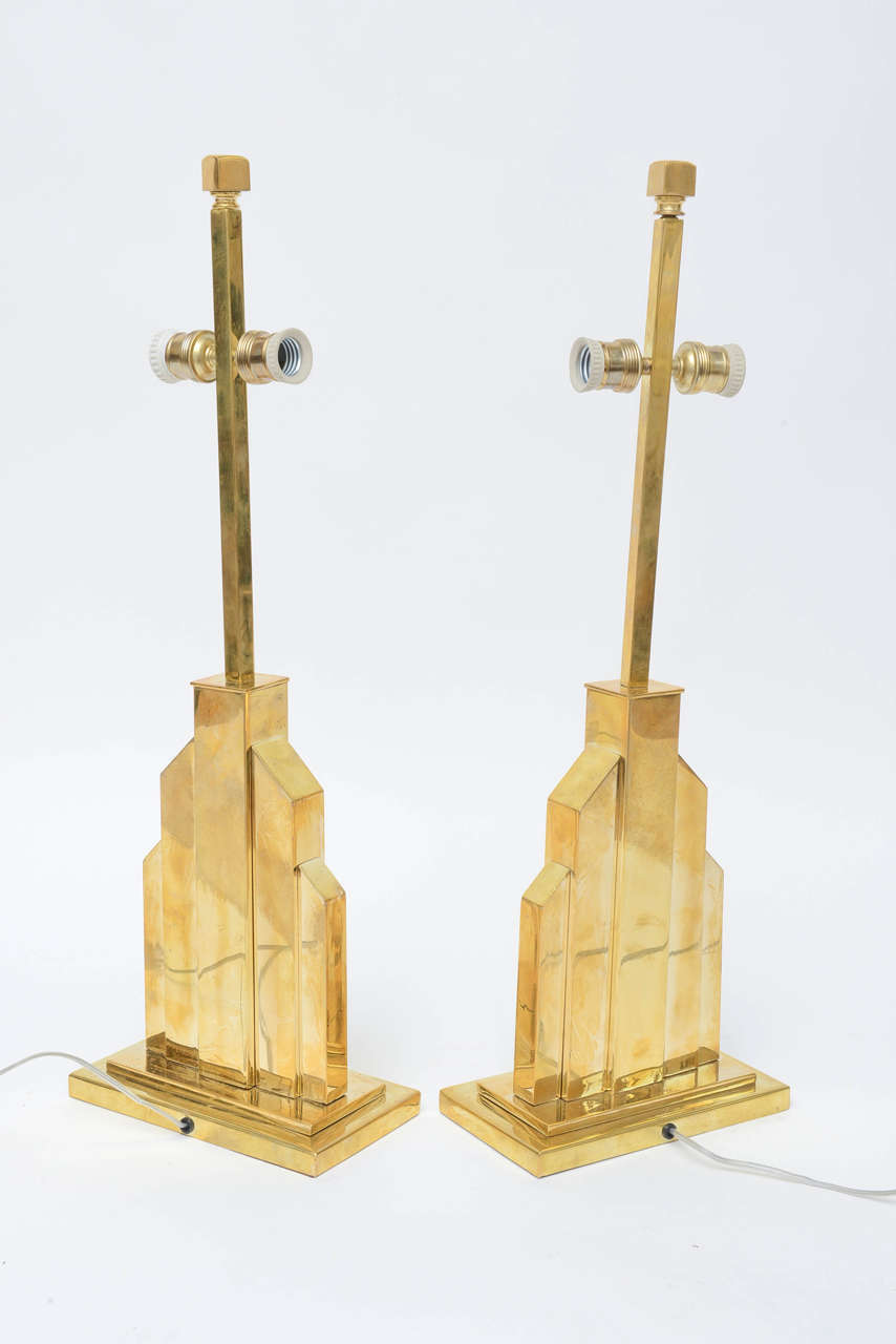 Pair of Rome Rega Skyscraper shaped two lights Table lamps in brass. 
Mid-Century Modern Design made in Italy circa late 1970s.
US Rewiring and each Table Lamp takes 2 regular light bulbs or LED bulbs.
No Shades. 