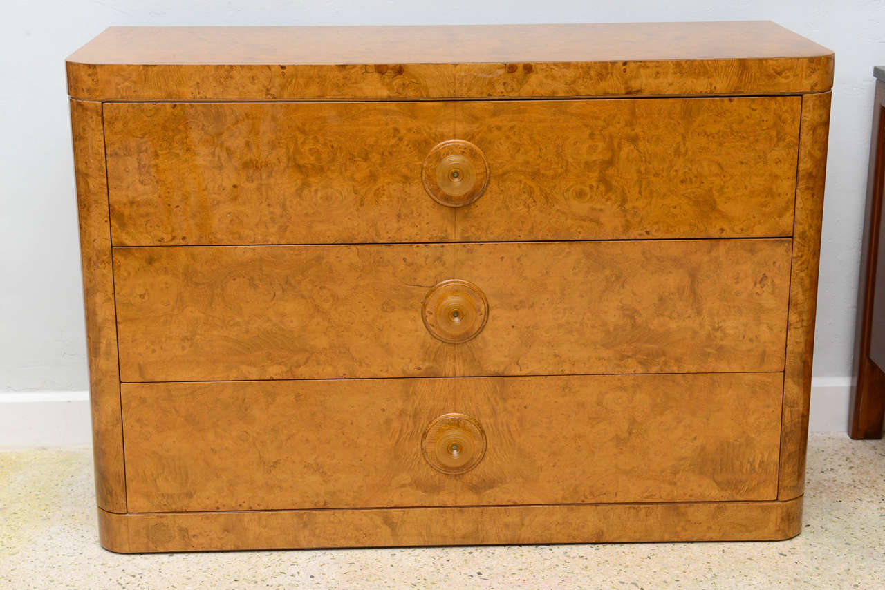 Late Art Deco burl birch, three-drawer commode of typical form.