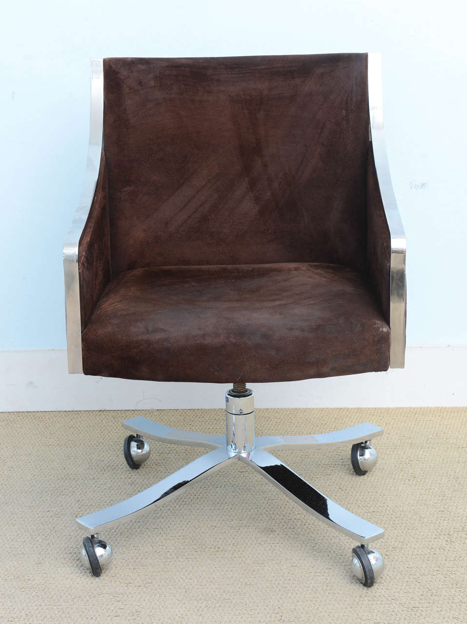 Sleek pair of Polished Stainless Steel  Stow  & Davis Office , desk chairs . These are quite comfortable and still retain the original Brown Real Suede Upholstery ,  these where professionally clean ,however you might want to reupholster them with
