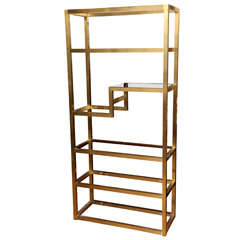 A French Brass 5 Tiered Etagere with Flush Glass Shelves
