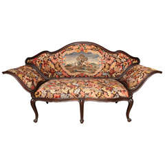 An Italian Walnut Sofa Covered in Needlework with Petit Point
