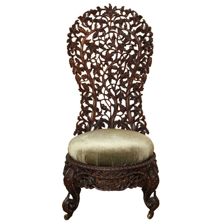 A Hand Carved Rosewood Burmese Slipper Chair
