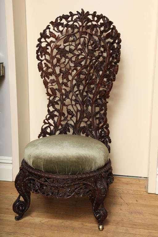 A Hand Carved Rosewood Burmese Slipper Chair at 1stDibs