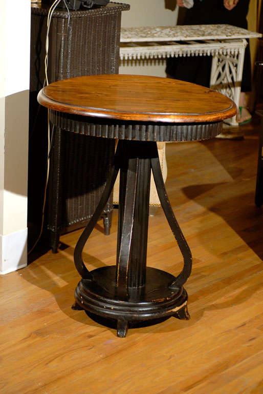 This is a lovely English Pine Arts & Crafts style table.  The pedestal is shaped nicely allowing the table to have movement and flow visually.  The apron also has a nice repeating pattern.  The table is slightly bowed which is common for furniture