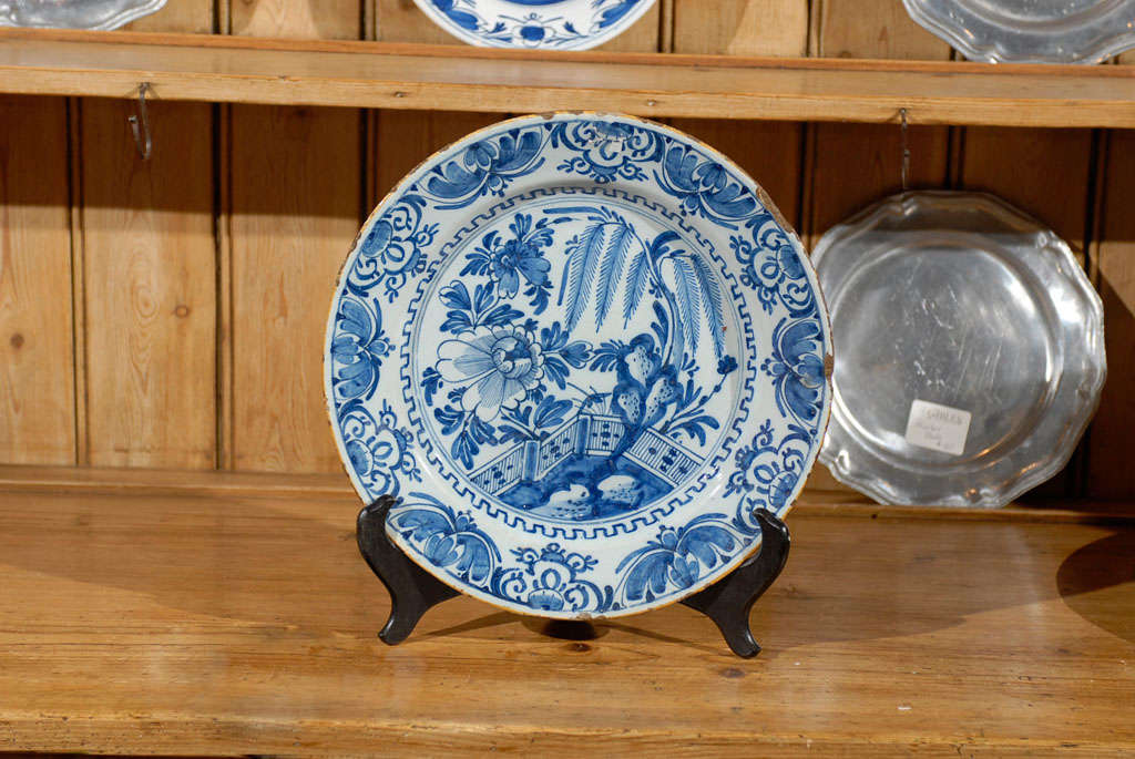 Blue and white delft charger with an all over pattern