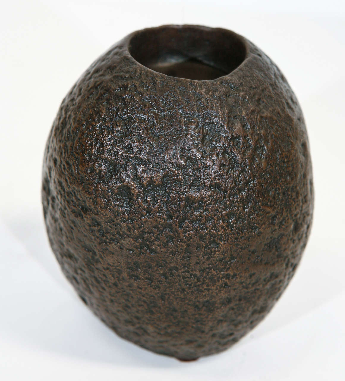 New cast bronze rock, function as a small planter or vase on one end or as a candleholder on the other end, American.