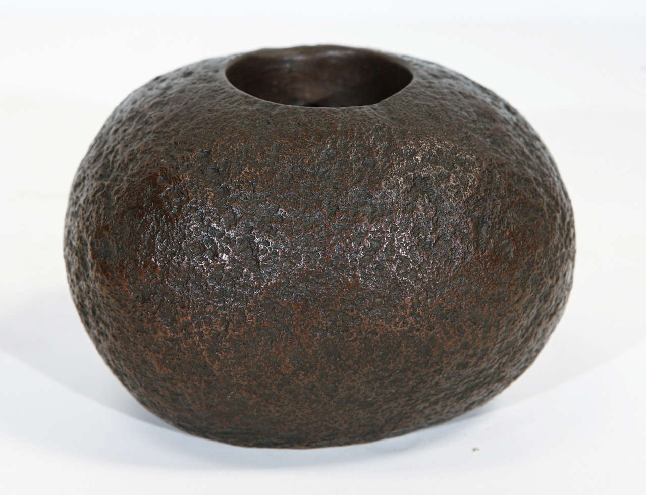 New cast oval bronze rock, functions as a small planter or vase on one end or as a candleholder on the other end, American.
7-8 week lead time for production if not in stock.