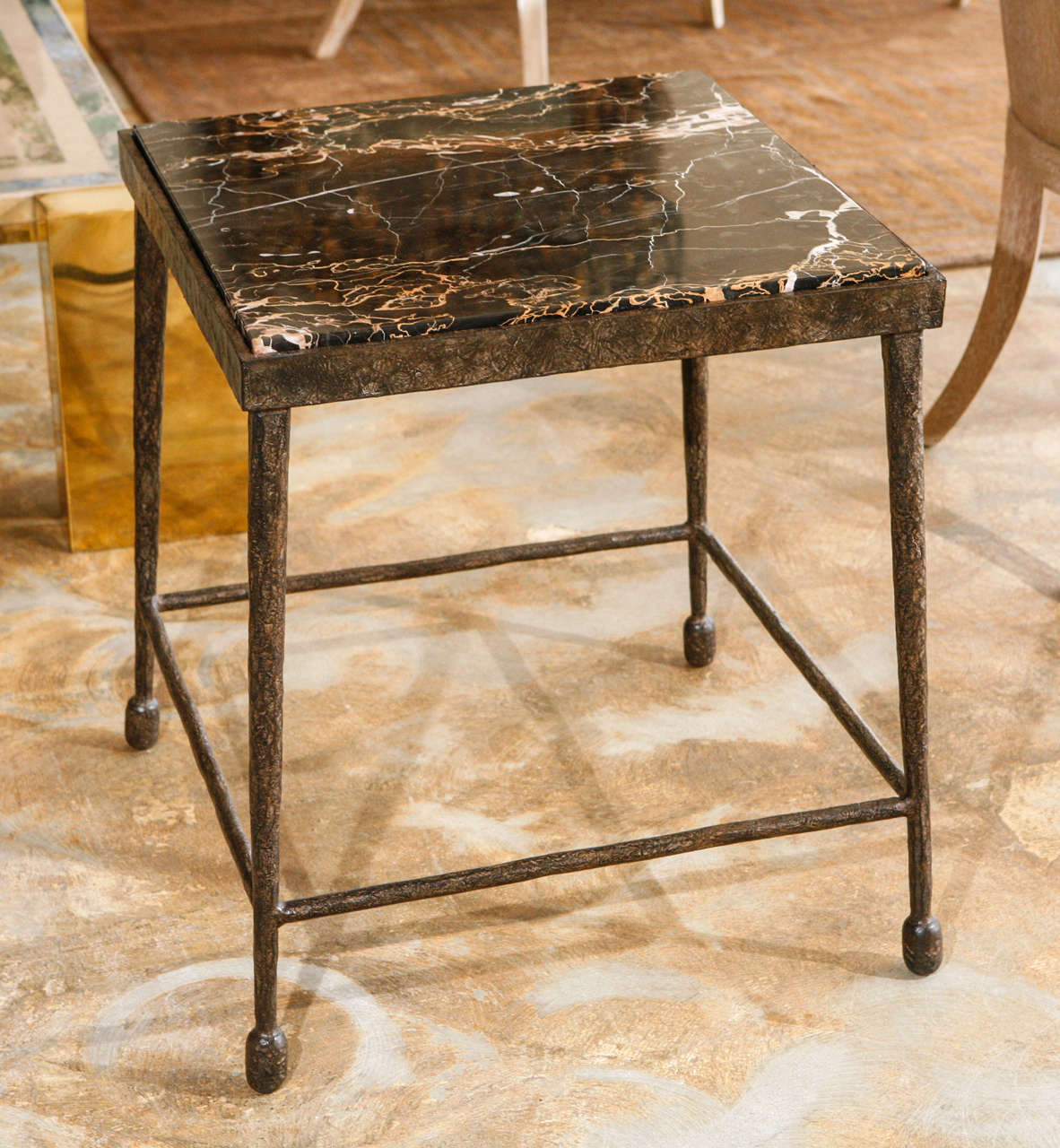 Modern, organic stone and textured iron side table. Giacometti flare. Single as shown in stock. Price is for the single table in stock, and the stone is no longer available. Also available to order with other top materials (see our separate listing