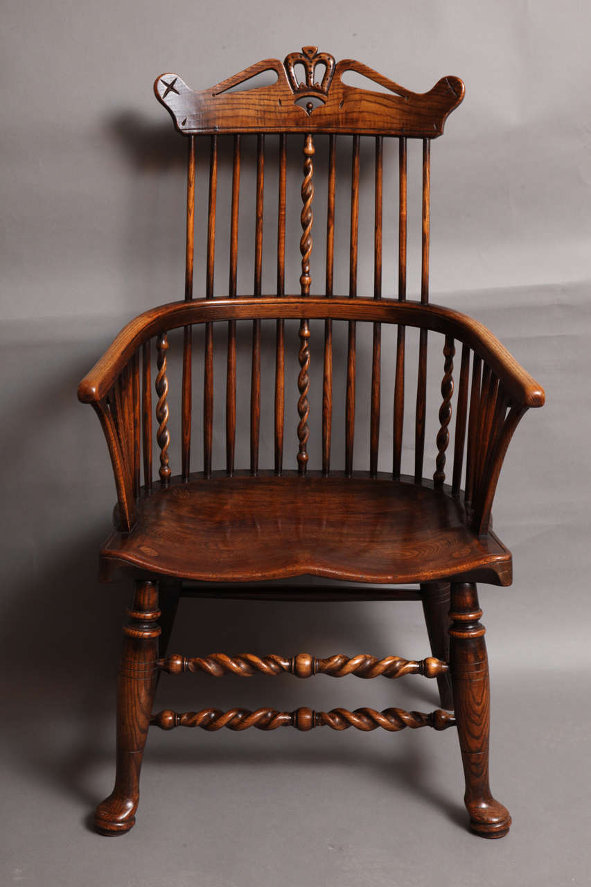 Remarkable early 20th Century English Thames Valley comb back windsor armchair, possibly by Edwin Skull or another equally capable maker who worked in the same manner as the 18th Century craftsman of that area.  This chair has crown carved crest