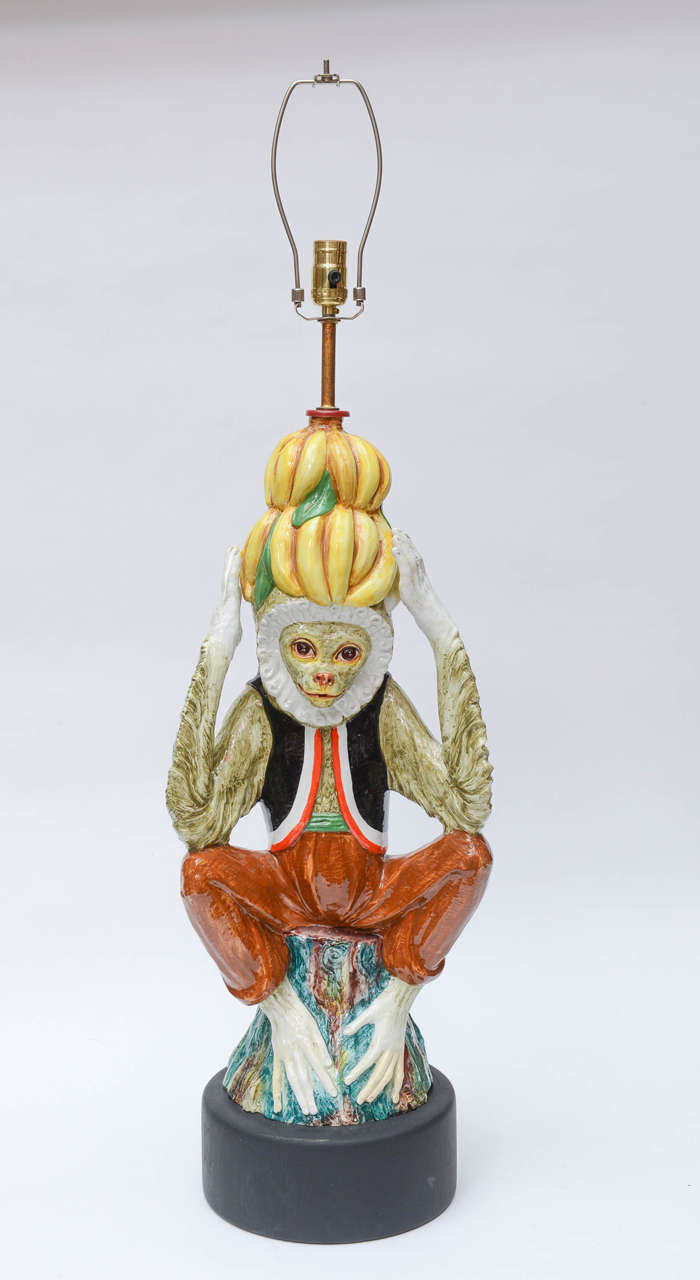 Whimsical and decorative painted Italian ceramic lamp with monkey and banana motif. So Palm Beach!
