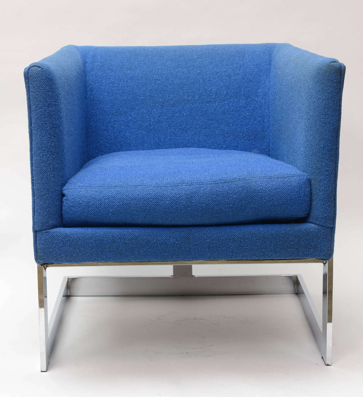 Smart pair of chrome Milo Baughman chairs with blue upholstery.