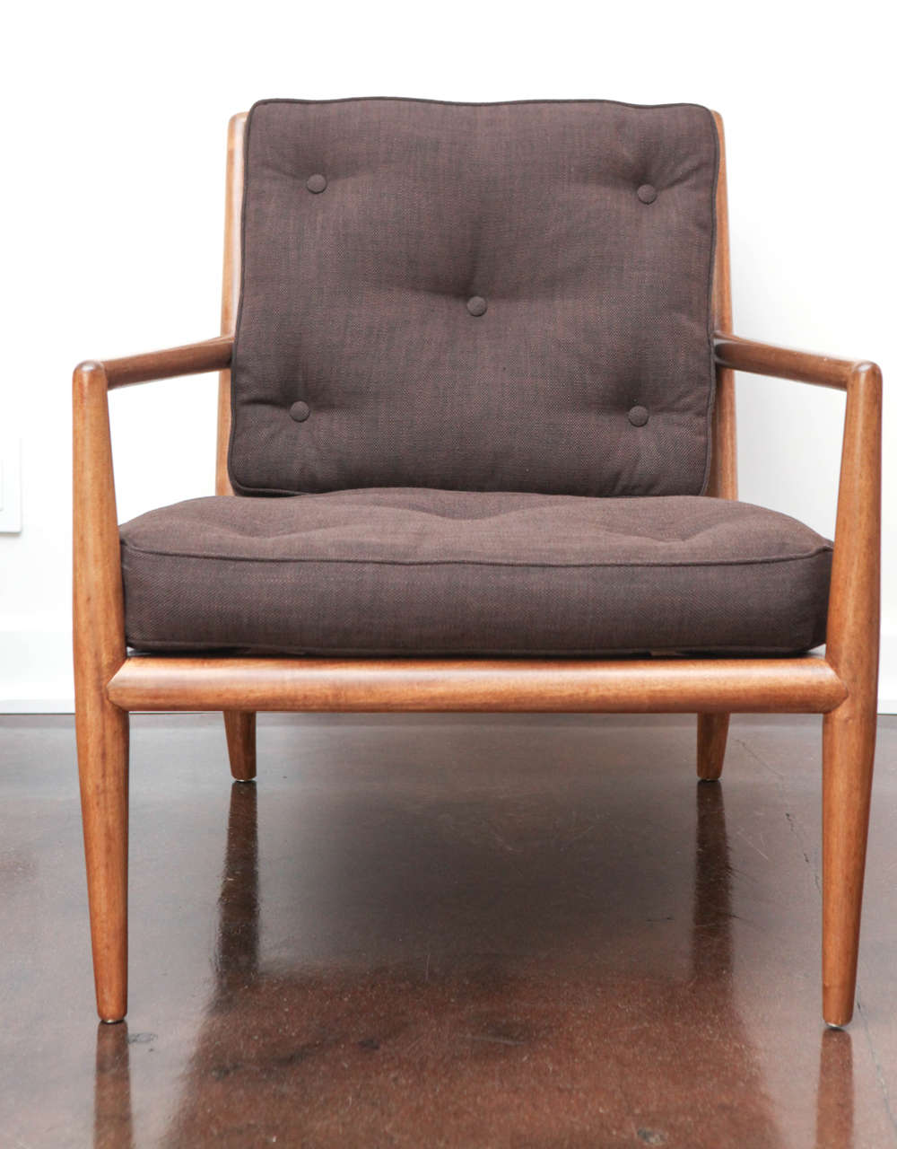 Classic walnut lounge chair, model WWZ, designed by T.H. Robsjohn-Gibbings.  Recently restored and reupholstered in a chocolate brown button-tufted pic-stitch cotton.