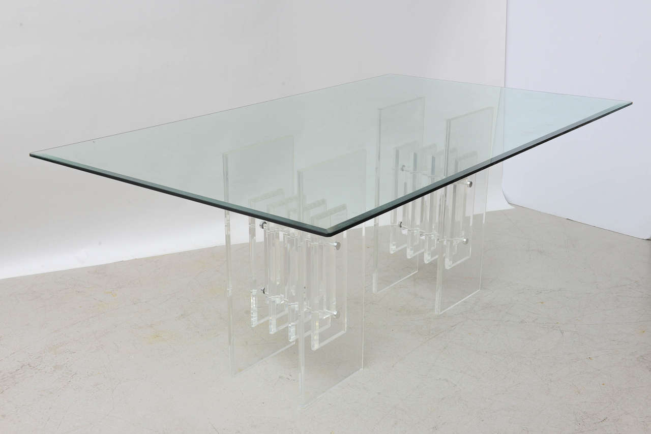 Heavy Lucite dining table signed Verano with rectangular glass top.