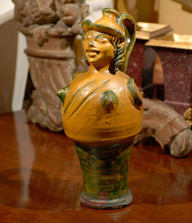 Late 19th-early 20th century French glazed pottery figural vessel.