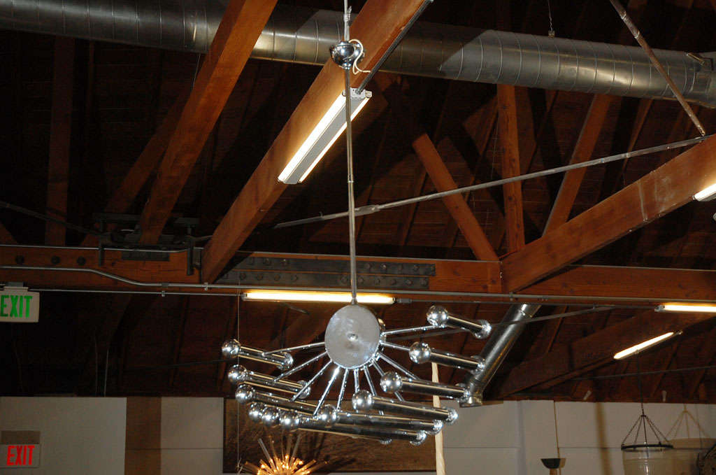 Chrome-plated multi-arm hanging fixture.