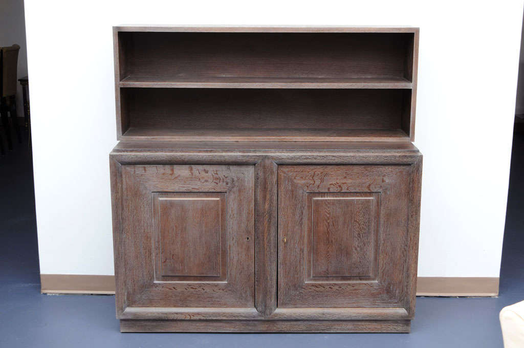 Superb piece of furniture excellent craftsmanship, in cerused golden oak, typical work in the style of the well knowned French designer Charles Dudouyt. Simple and very architectural construction.
Great proportion and elegant design.
Shelves in both