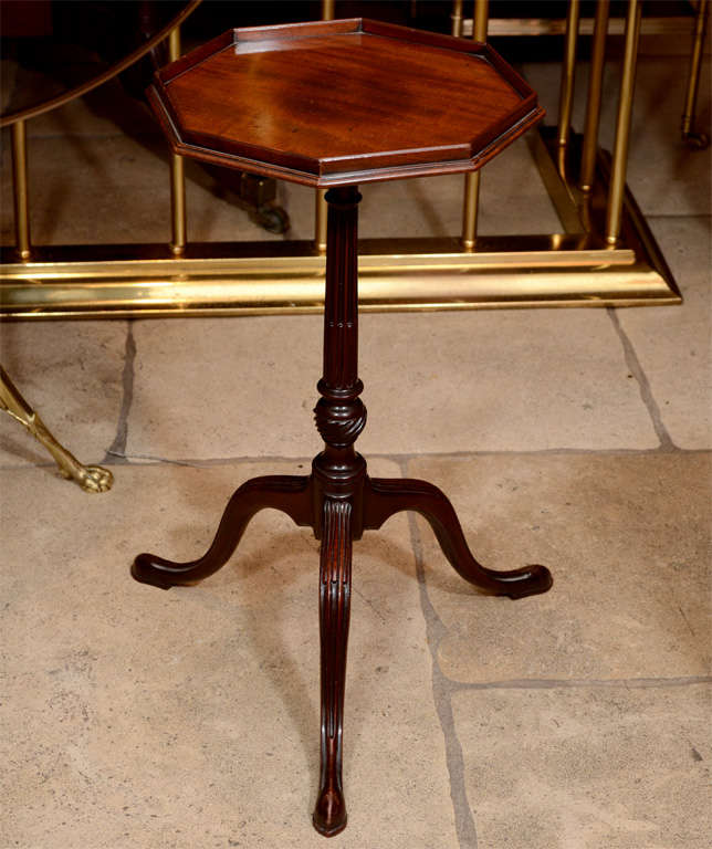 A very fine George III mahogany wine table with octagonal top, stop fluted column and legs.