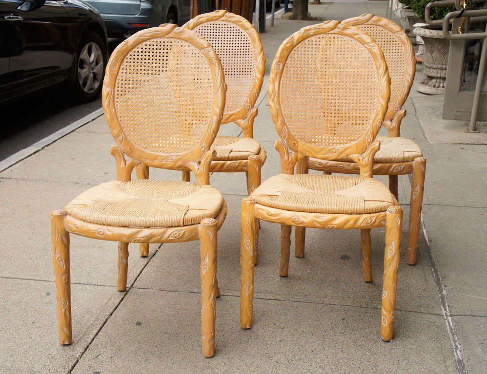 Carved to resemble naturally growing wood, these cane medallion back chairs offer a fresh modern approach to the Louis XVI style.  The rush seats give them an easy feel but that can be easily removed and an upholstered drop seat put in its place.