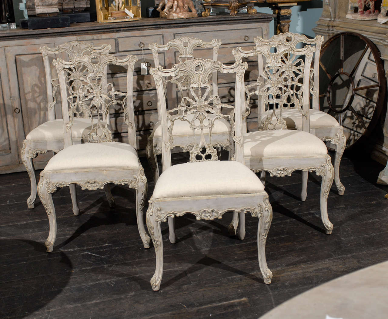 A Set of 10 Italian Painted Wood Chippendale Style Side Chairs with Carved Cabriole Legs. They have, in the typical Chippendale Style, Wonderfully Carved Backs, Crests and Ears and Nicely Carved Skirt. The photo shows only 6 but there are 10 indeed.