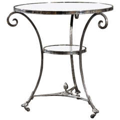 A Round Side Table With Mirrored Top