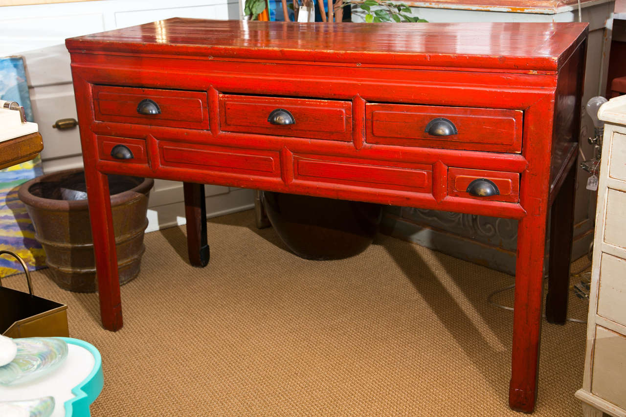 Simple Asian design sideboard painted in a deep red. The perfect height for serving or display, with five deep drawers.