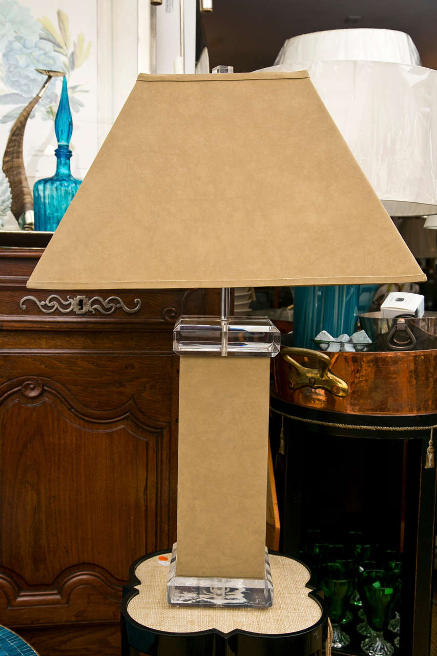 A solid Lucite table lamp wrapped in a caramel tone suede with a matching suede shade. Signed "Verano" of Italy