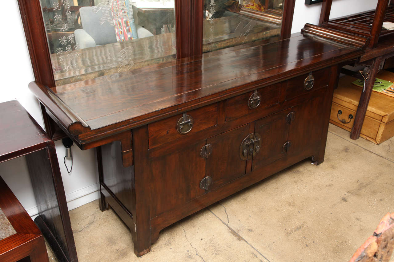 A three drawer coffer sideboard or buffet with doors and everted flanges.  Dim: 81