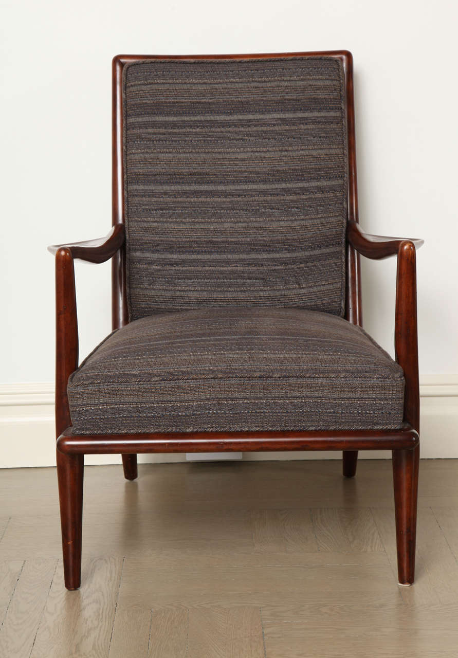 Pair of T. H. Robsjohn-Gibbings armchairs. Walnut frame and recently reupholstered in a blue linen mix fabric.